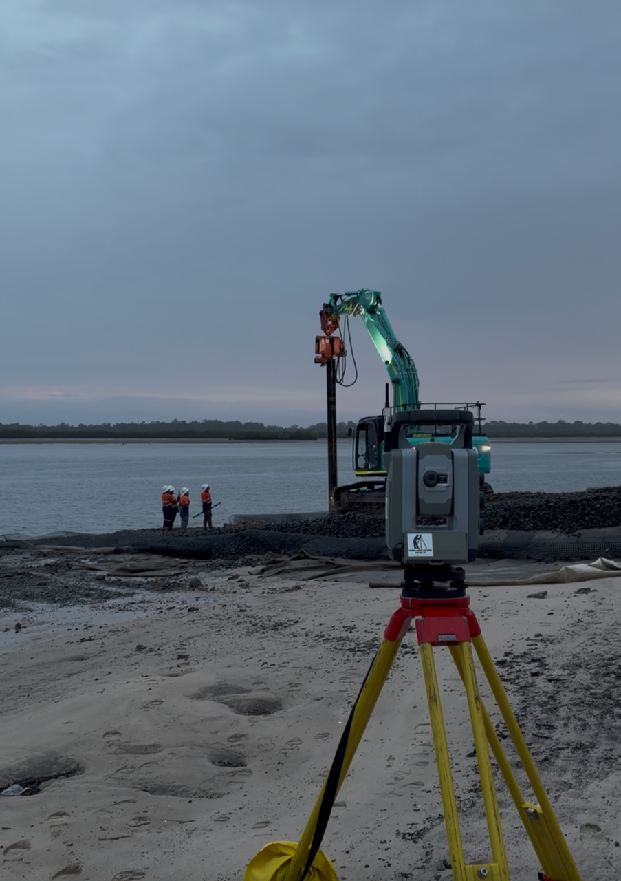 Total station set up on a riverside construction site